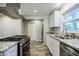 Modern kitchen features granite countertops, stainless steel appliances, and ample cabinet space at 2343 Hunting Valley Dr, Decatur, GA 30033