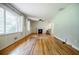 Spacious living room with hardwood floors, a fireplace, and ample natural light at 2343 Hunting Valley Dr, Decatur, GA 30033