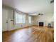 Spacious living room with hardwood floors, a fireplace, and ample natural light at 2343 Hunting Valley Dr, Decatur, GA 30033