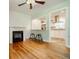 Living room with hardwood floors and view of kitchen and fireplace at 2343 Hunting Valley Dr, Decatur, GA 30033