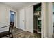 Hallway pantry with white bi-fold doors, wood-look tile floors, and plenty of storage at 2343 Hunting Valley Dr, Decatur, GA 30033