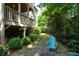 Backyard stone patio area with fire pit and lush greenery, perfect for outdoor entertaining at 3423 Mulberry Lane Ct, Dacula, GA 30019