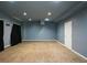 Large basement space with neutral carpet, ample room for entertainment or storage at 3423 Mulberry Lane Ct, Dacula, GA 30019