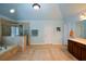 Bathroom featuring tile floors, walk-in shower, tub, and double doors at 3423 Mulberry Lane Ct, Dacula, GA 30019