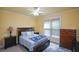 This bedroom features a ceiling fan and ample natural light, creating a cozy and inviting space at 3423 Mulberry Lane Ct, Dacula, GA 30019