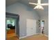 Spacious bedroom with vaulted ceiling, ceiling fan, and attached bathroom for comfortable living at 3423 Mulberry Lane Ct, Dacula, GA 30019