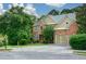 Lovely brick home with well-kept lawn, two-car garage and mature landscaping at 3423 Mulberry Lane Ct, Dacula, GA 30019