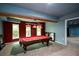 Finished basement game room with a pool table and natural light at 3423 Mulberry Lane Ct, Dacula, GA 30019