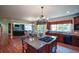 Open kitchen with island cooktop, breakfast area, and easy access to the living area at 3423 Mulberry Lane Ct, Dacula, GA 30019