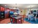 Kitchen with island cooktop, breakfast area, and easy access to the living area at 3423 Mulberry Lane Ct, Dacula, GA 30019