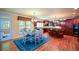 A well-equipped kitchen with dark cabinets, hardwood floors and a large island with an attached dining area at 3423 Mulberry Lane Ct, Dacula, GA 30019