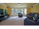 Comfortable living room features large windows, plush seating, and media center at 3423 Mulberry Lane Ct, Dacula, GA 30019
