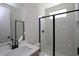 Modern bathroom featuring a glass-enclosed shower, sleek fixtures, and a clean, minimalist design at 4435 Beechnut Cir, Cumming, GA 30028