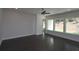 Bright and airy bedroom showcasing hardwood floors, neutral walls, and large windows overlooking the yard at 4435 Beechnut Cir, Cumming, GA 30028