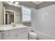 Bright bathroom with a white vanity, tub, and shower combination, creating a fresh space at 659 Holcomb Bridge Rd, Norcross, GA 30071