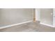 Large bedroom with neutral paint and carpeting, showcasing a door that enters an adjacent room at 659 Holcomb Bridge Rd, Norcross, GA 30071