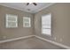 Bright bedroom with three windows and neutral carpeting, creating a cozy atmosphere at 659 Holcomb Bridge Rd, Norcross, GA 30071
