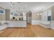 Dining area features hardwood floors, built in seating and access to open floorplan kitchen area at 659 Holcomb Bridge Rd, Norcross, GA 30071