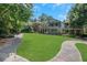Expansive green front yard with walkway, benches, and beautifully landscaped surroundings for outdoor enjoyment at 659 Holcomb Bridge Rd, Norcross, GA 30071