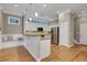 Bright kitchen features stainless steel appliances, granite countertops, and breakfast bar with seating at 659 Holcomb Bridge Rd, Norcross, GA 30071