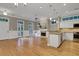 Open concept living space and kitchen with fireplace at 659 Holcomb Bridge Rd, Norcross, GA 30071