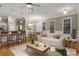 Bright living room with open floor plan with hardwood floors, modern decor, and stylish furnishings at 659 Holcomb Bridge Rd, Norcross, GA 30071