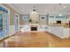 Bright living room with open floor plan with hardwood floors, a fireplace and access to outdoor deck at 659 Holcomb Bridge Rd, Norcross, GA 30071