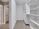 Spacious walk-in closet with custom shelving and storage solutions, providing ample space at 659 Holcomb Bridge Rd, Norcross, GA 30071