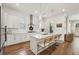 Bright kitchen with white cabinets, subway tile backsplash, and stainless steel appliances at 115 Ivey Way, Woodstock, GA 30188