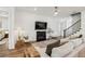 Comfortable living room featuring a fireplace, hardwood floors, and stylish seating, creating a cozy space at 115 Ivey Way, Woodstock, GA 30188