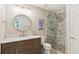 Modern bathroom featuring a vanity with drawers, a walk-in shower, and updated fixtures at 299 Azalea Cir, Cumming, GA 30040