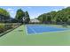 Well-maintained tennis courts available in the community with green and blue surface at 299 Azalea Cir, Cumming, GA 30040