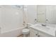 Bright bathroom features a tub, shower, toilet, sink, and vanity with modern finishes at 384 Daniel Mill Xing, Villa Rica, GA 30180
