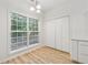 Bright dining area with large windows, closet and wood-look flooring at 384 Daniel Mill Xing, Villa Rica, GA 30180