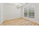 Dining room featuring modern chandelier and natural light from the large window at 384 Daniel Mill Xing, Villa Rica, GA 30180