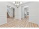 Dining room showcasing modern chandelier, wainscoting, and stylish flooring at 384 Daniel Mill Xing, Villa Rica, GA 30180