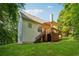 The exterior shows a home with a spacious backyard, complimented by a deck perfect for entertaining at 384 Daniel Mill Xing, Villa Rica, GA 30180