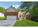 Charming single-Gathering home featuring a brick facade, two-car garage, and well-manicured lawn at 384 Daniel Mill Xing, Villa Rica, GA 30180