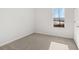 The carpeted bedroom features a sun-filled window and neutral walls at 4453 Manor Hill Dr, Union City, GA 30291