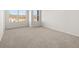 Sunlit bedroom featuring plush carpet, expansive windows, and neutral décor at 4453 Manor Hill Dr, Union City, GA 30291