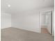 Spacious bedroom with neutral carpet and an ensuite bathroom entrance at 4453 Manor Hill Dr, Union City, GA 30291