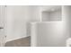 Upstairs hallway showcasing carpeted floors and bright white walls, offering a clean aesthetic at 4453 Manor Hill Dr, Union City, GA 30291