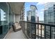 Enjoy city views from this cozy balcony with comfortable seating at 1080 Peachtree Ne St # 2710, Atlanta, GA 30309