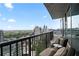 Relax on this inviting balcony with comfortable seating and cityscape views at 1080 Peachtree Ne St # 2710, Atlanta, GA 30309