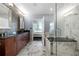 Elegant bathroom featuring marble tiling, a soaking tub, and glass shower at 1080 Peachtree Ne St # 2710, Atlanta, GA 30309