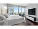 This bedroom has beautiful flooring and an amazing balcony view at 1080 Peachtree Ne St # 2710, Atlanta, GA 30309