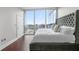 Light-filled bedroom with floor-to-ceiling windows offering panoramic city views at 1080 Peachtree Ne St # 2710, Atlanta, GA 30309