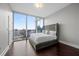 Inviting bedroom with large windows showcasing expansive city views at 1080 Peachtree Ne St # 2710, Atlanta, GA 30309