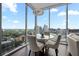 Contemporary dining area with a modern chandelier and an attractive city view as backdrop, perfect for intimate meals at 1080 Peachtree Ne St # 2710, Atlanta, GA 30309