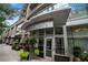 Building entrance with plants and greenery at 1080 Peachtree Ne St # 2710, Atlanta, GA 30309